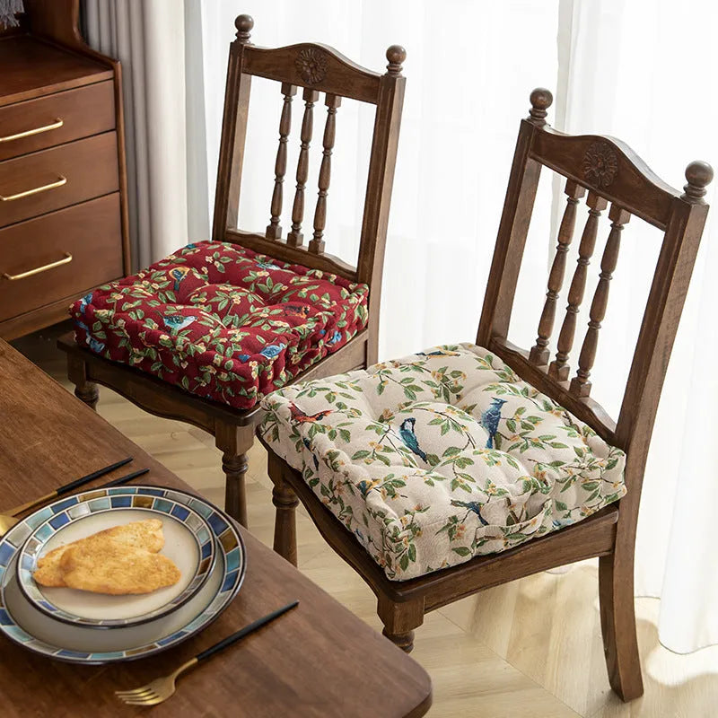 American-style square dining chair cushion for back support in apricot floral pattern.