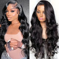 Black synthetic lace front wig with large wavy curls on a wig stand.