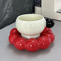 Ceramic coffee cup and dish set in a Nordic style, shown in a choice of solid colours.