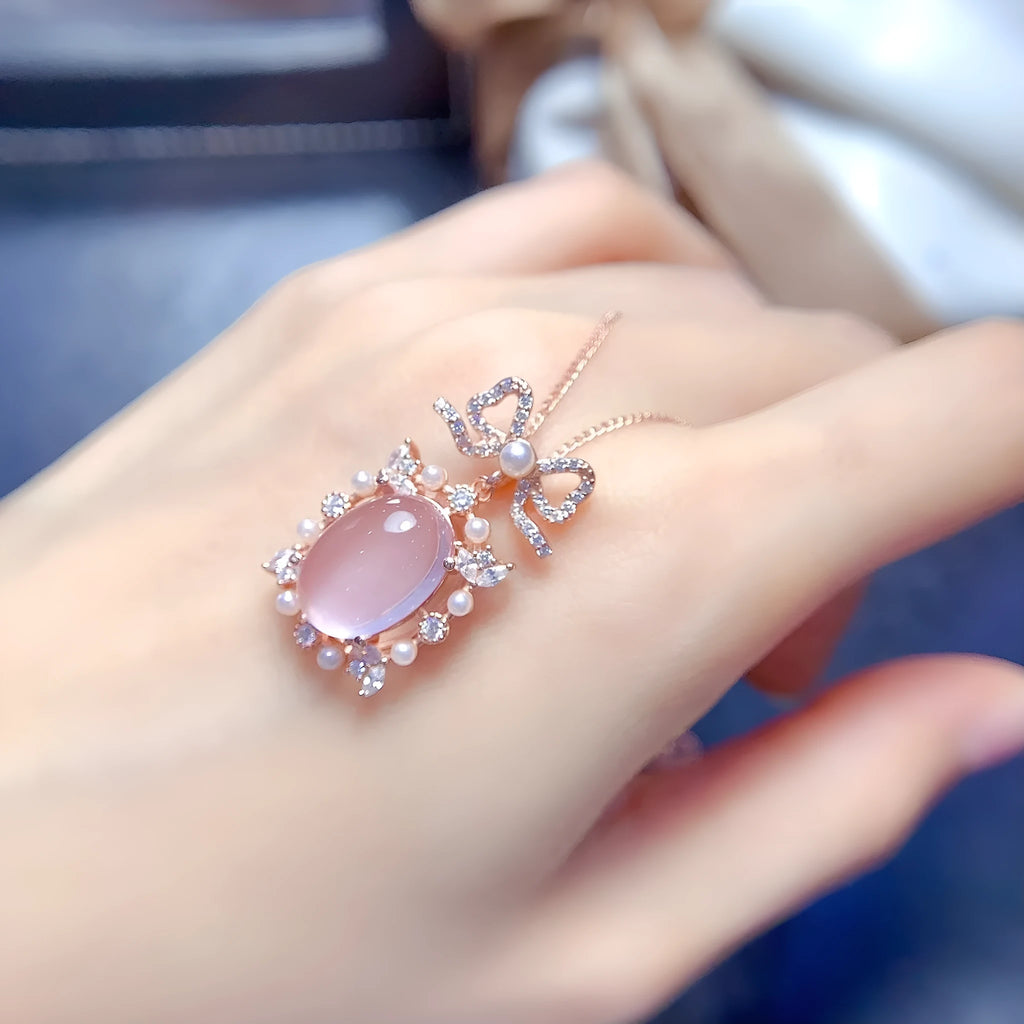 Geometric rose quartz pendant necklace on a silver chain with rose gold plating