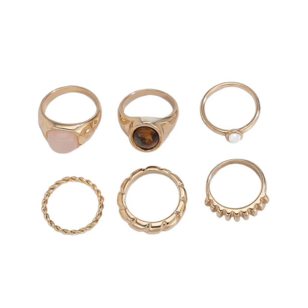 Six geometric alloy rings in light gold finish for women