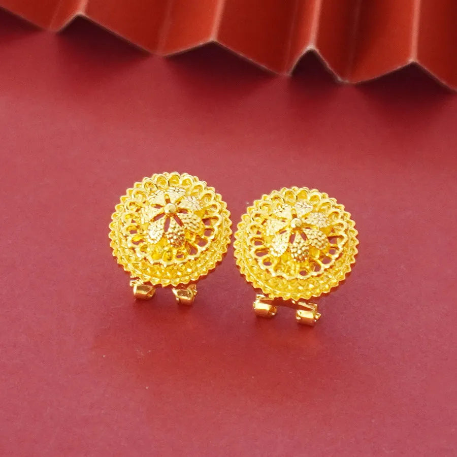 Gold-plated three-piece jewellery set with necklace, earrings, and ring in a floral design.