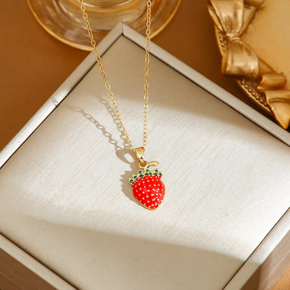 Women's titanium steel necklace with delicate indie pendant designs including strawberry, cherry, and pepper motifs