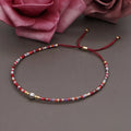 A colourful Bohemian style beaded bracelet with semi-precious stone and glass beads on an adjustable strap.