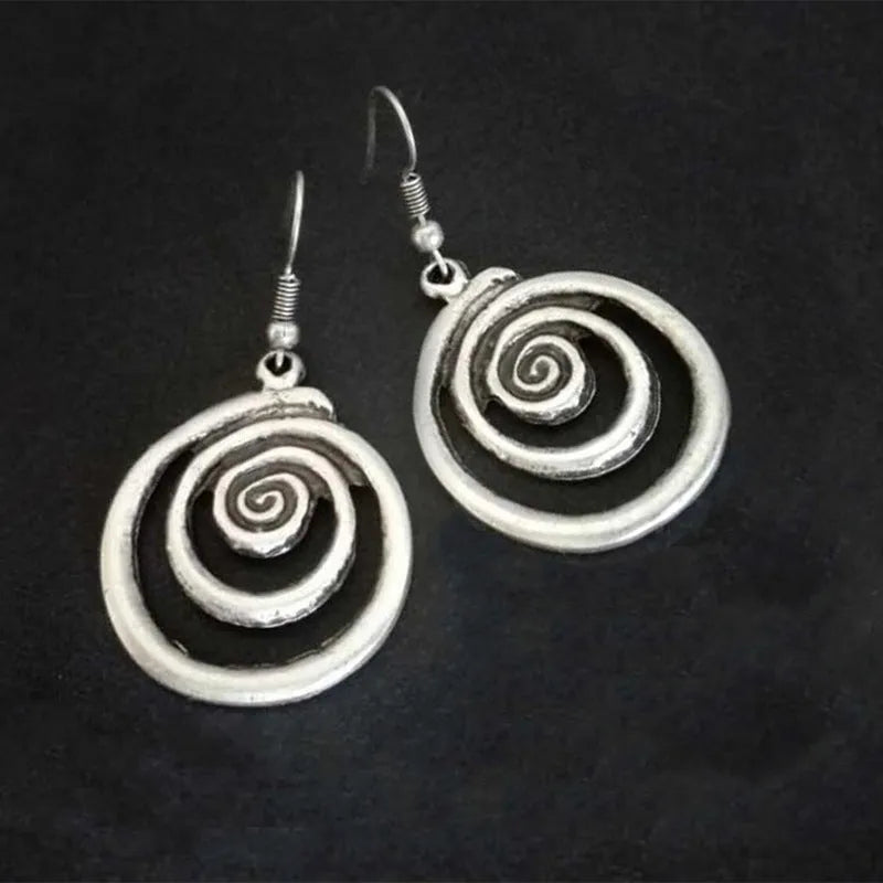 Silver geometric spiral distressed earrings showing alloy construction and 5cm drop length