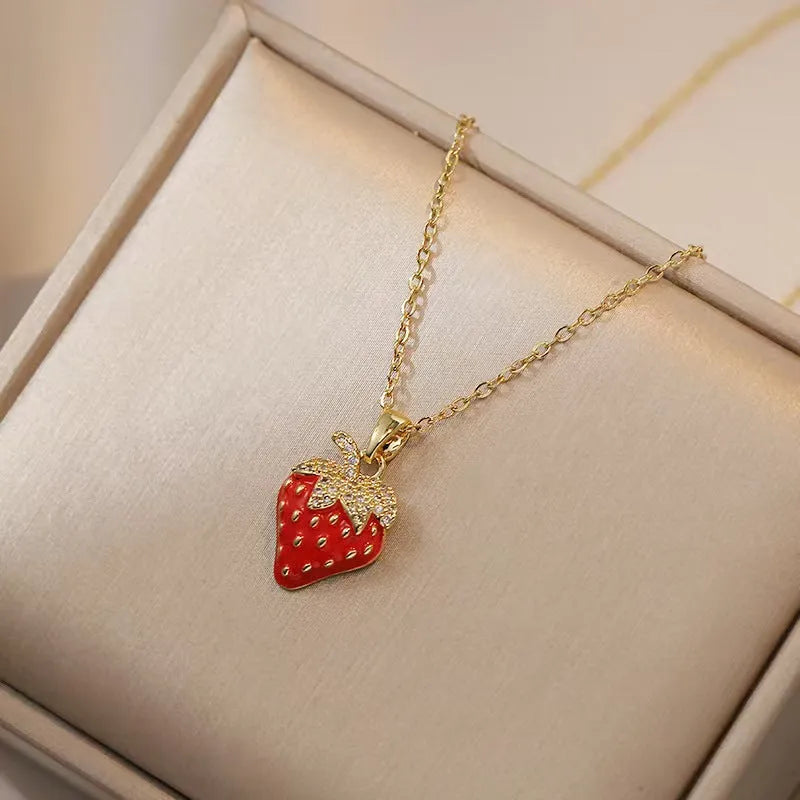 Women's titanium steel necklace with delicate indie pendant designs including strawberry, cherry, and pepper motifs