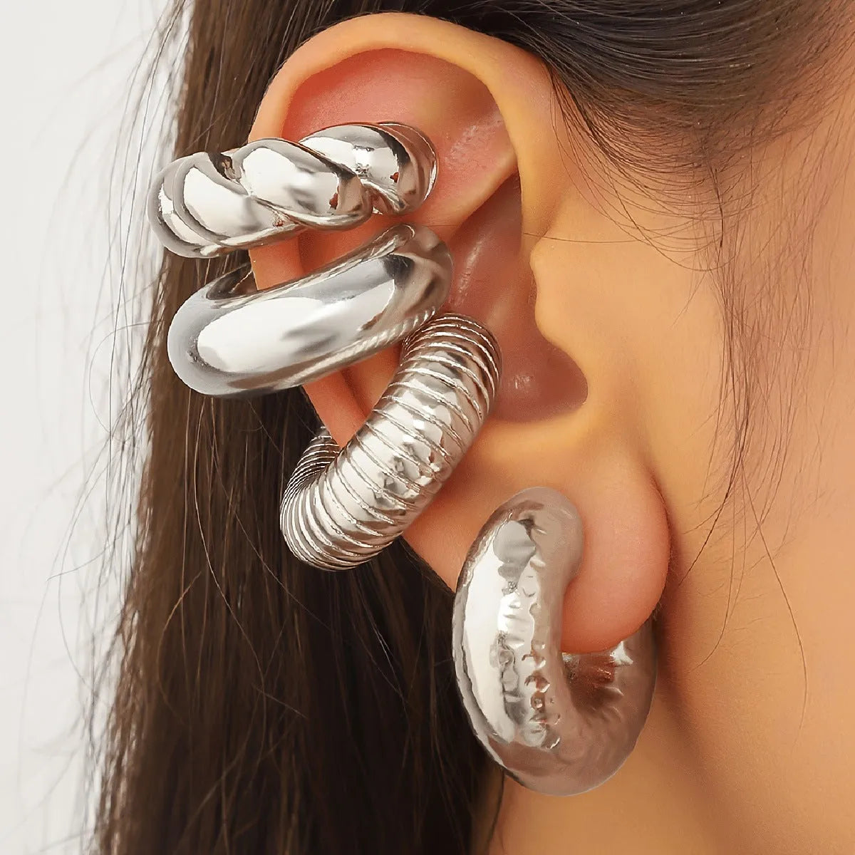 Women's geometric ear clip set in gold and silver colours with clip-on design