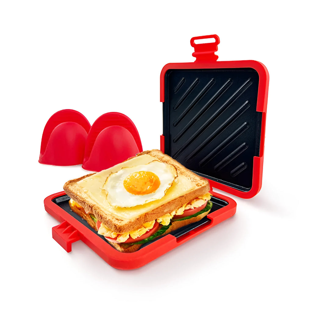 Red silicone baking tray with matching heat-resistant gloves on kitchen counter