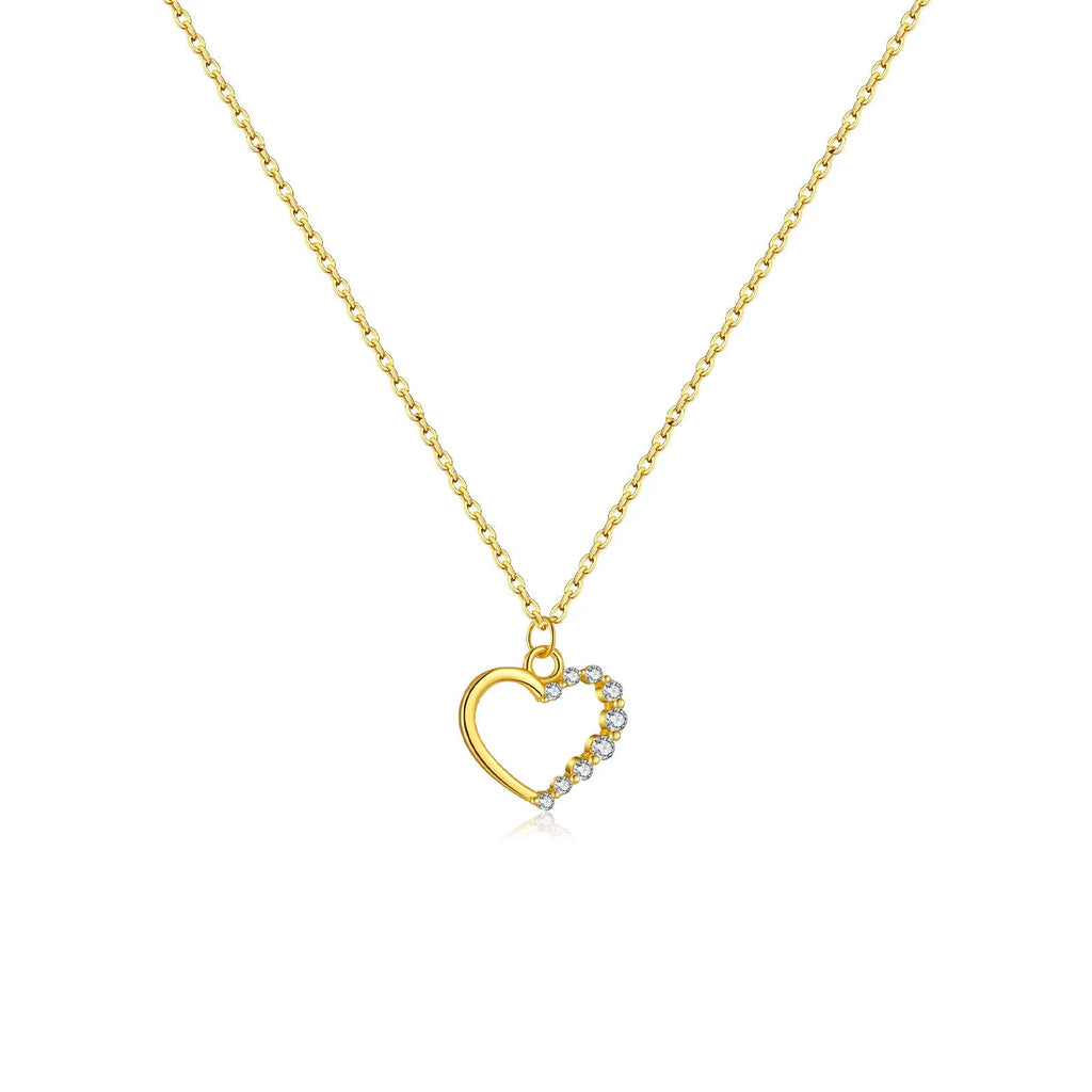 Sterling silver hollow heart necklace with circular details on a regular chain