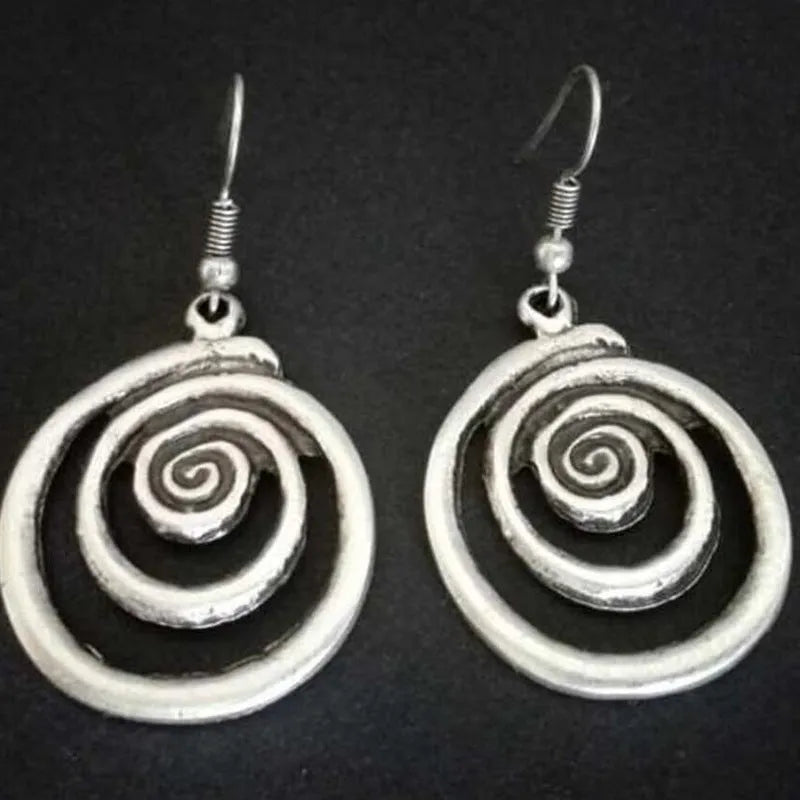 Silver geometric spiral distressed earrings showing alloy construction and 5cm drop length
