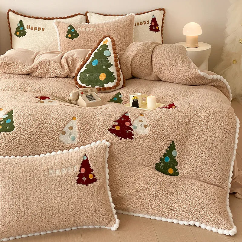 Bright yellow fleece-lined bedding set with embroidered cartoon Christmas tree pattern, including duvet cover, sheet, and pillowcases.