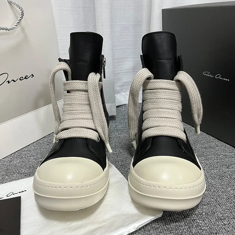Men's black high-top leather sneakers with a side zip on a white background