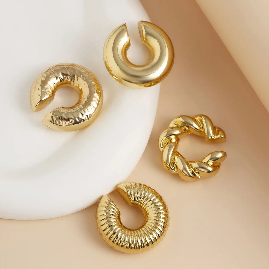 Women's geometric ear clip set in gold and silver colours with clip-on design