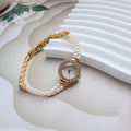 Women's light gold bracelet watch with freshwater pearls, round mineral glass dial, and stainless steel folding buckle
