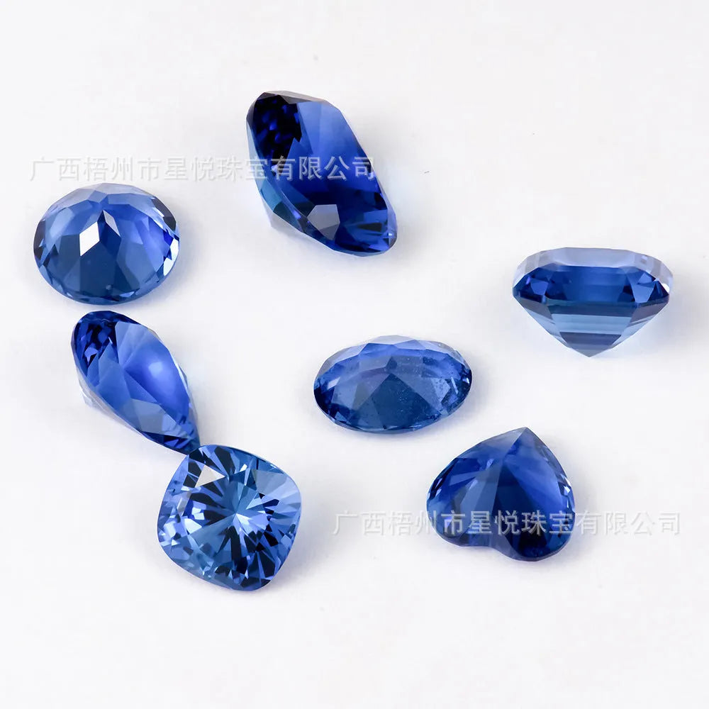 Royal blue love shaped tiara gemstones in various weights and shapes including heart, round, and pear styles