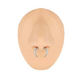 316L steel C-shaped nose ring in black and steel colour on a plain background, showing geometric shape.