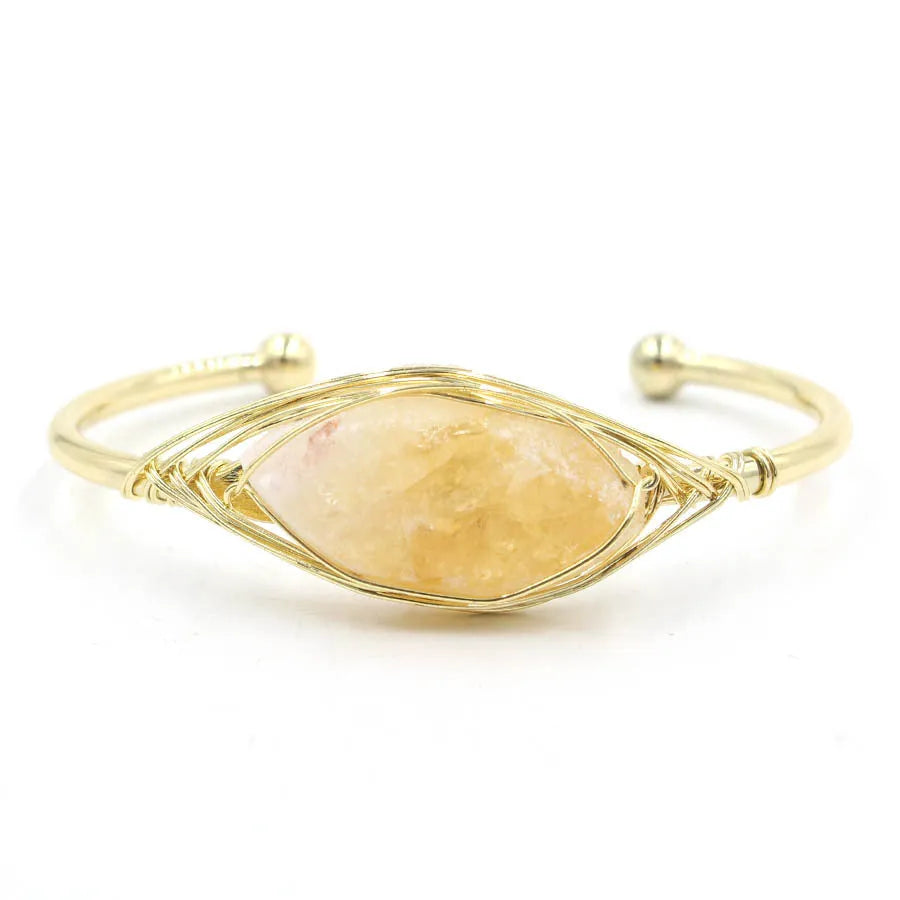 Natural raw gemstone bracelet with 8mm amorphous crystal beads on an adjustable open band.