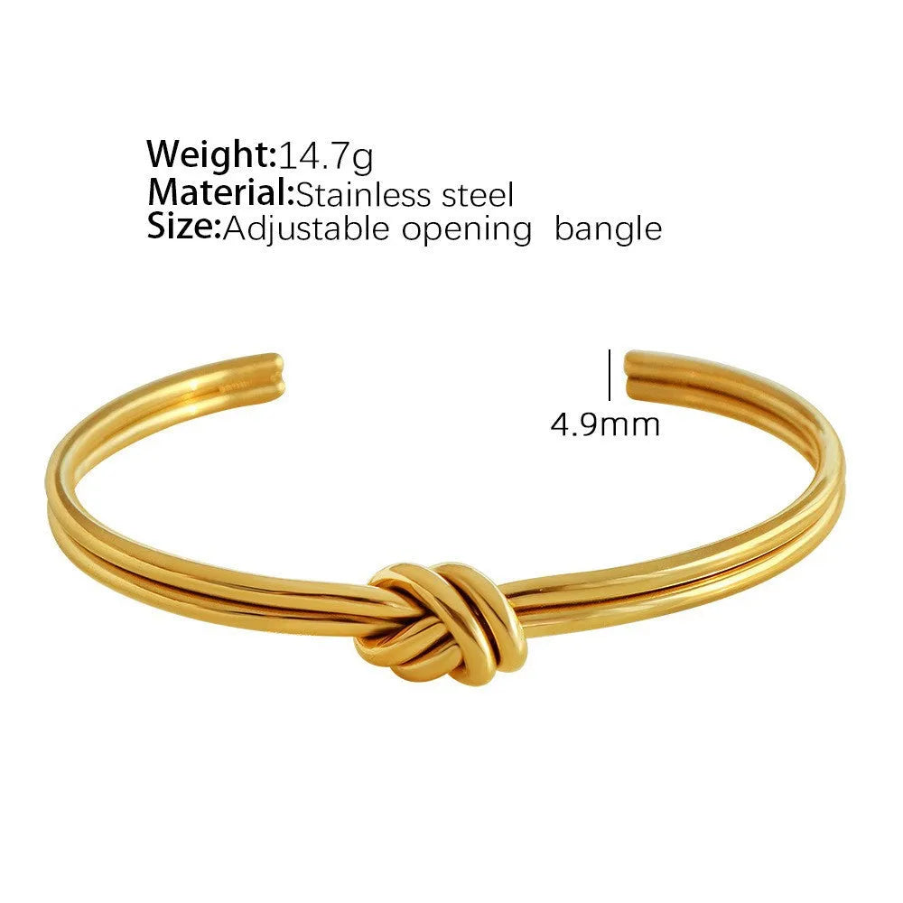 Adjustable C-shaped stainless steel bracelet with knotted double-layer design in gold or silver finish