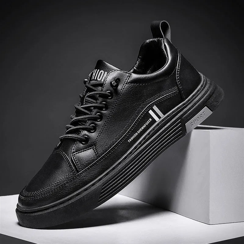 Men's white and black low-top skate shoes with elastic band and microfiber upper.
