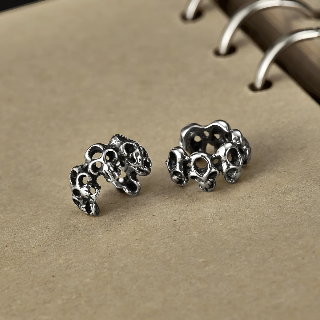 Retro hollow skull design stainless steel clip-on earrings with silver tone finish