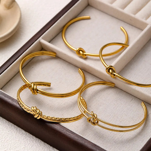 Adjustable C-shaped stainless steel bracelet with knotted double-layer design in gold or silver finish