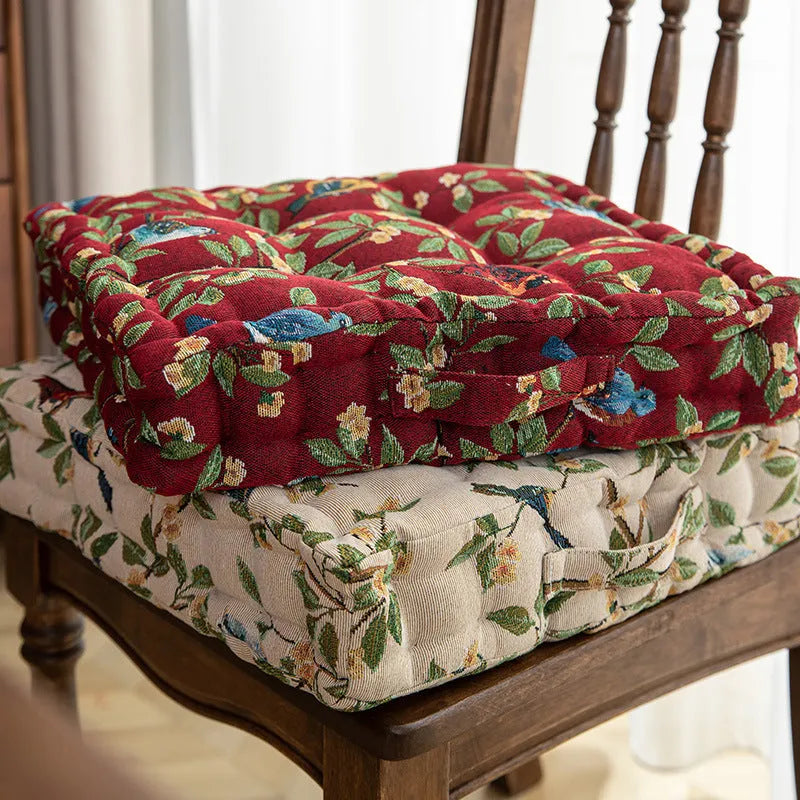 American-style square dining chair cushion for back support in apricot floral pattern.
