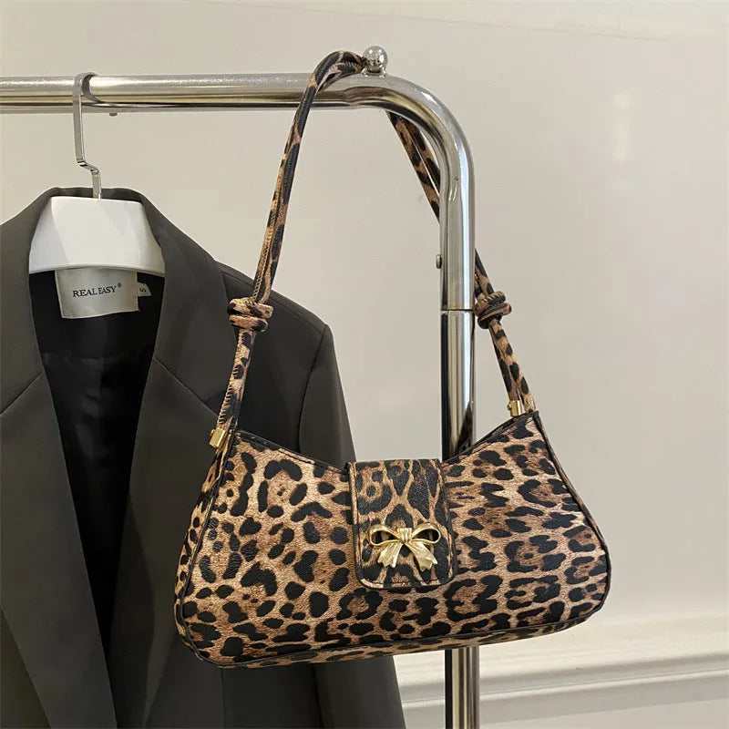 Large casual PU handbag for women in black, shown with sandwich pocket detail.