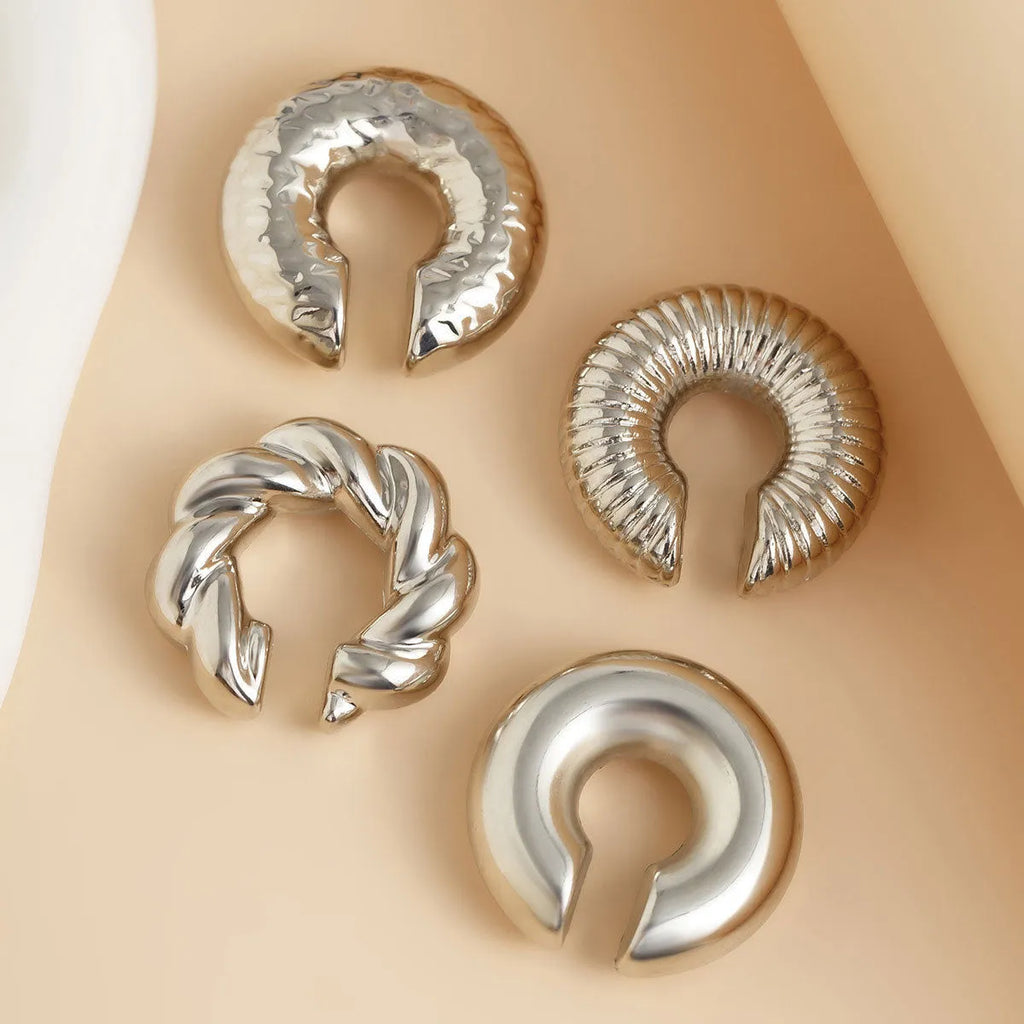 Women's geometric ear clip set in gold and silver colours with clip-on design