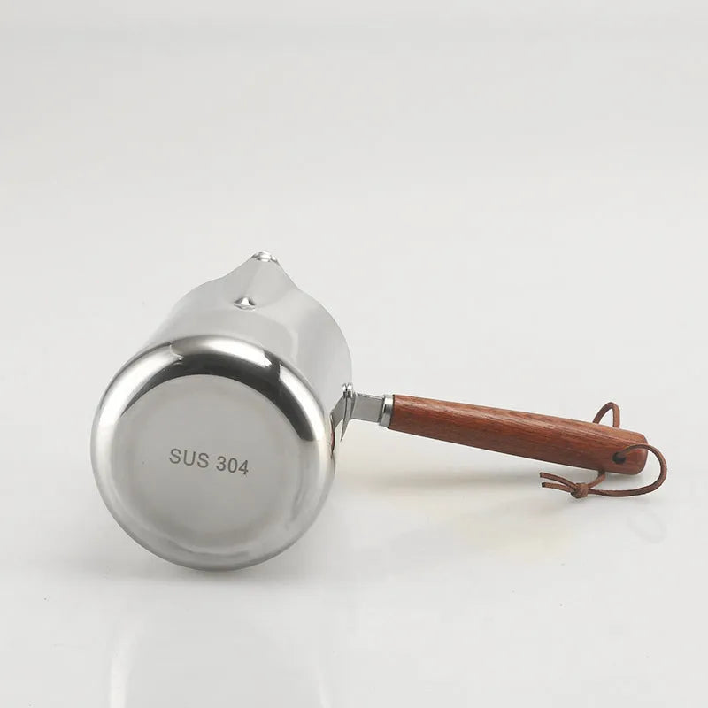 Stainless steel garland coffee cup with a scaled wooden handle shown in a simple, solid colour.