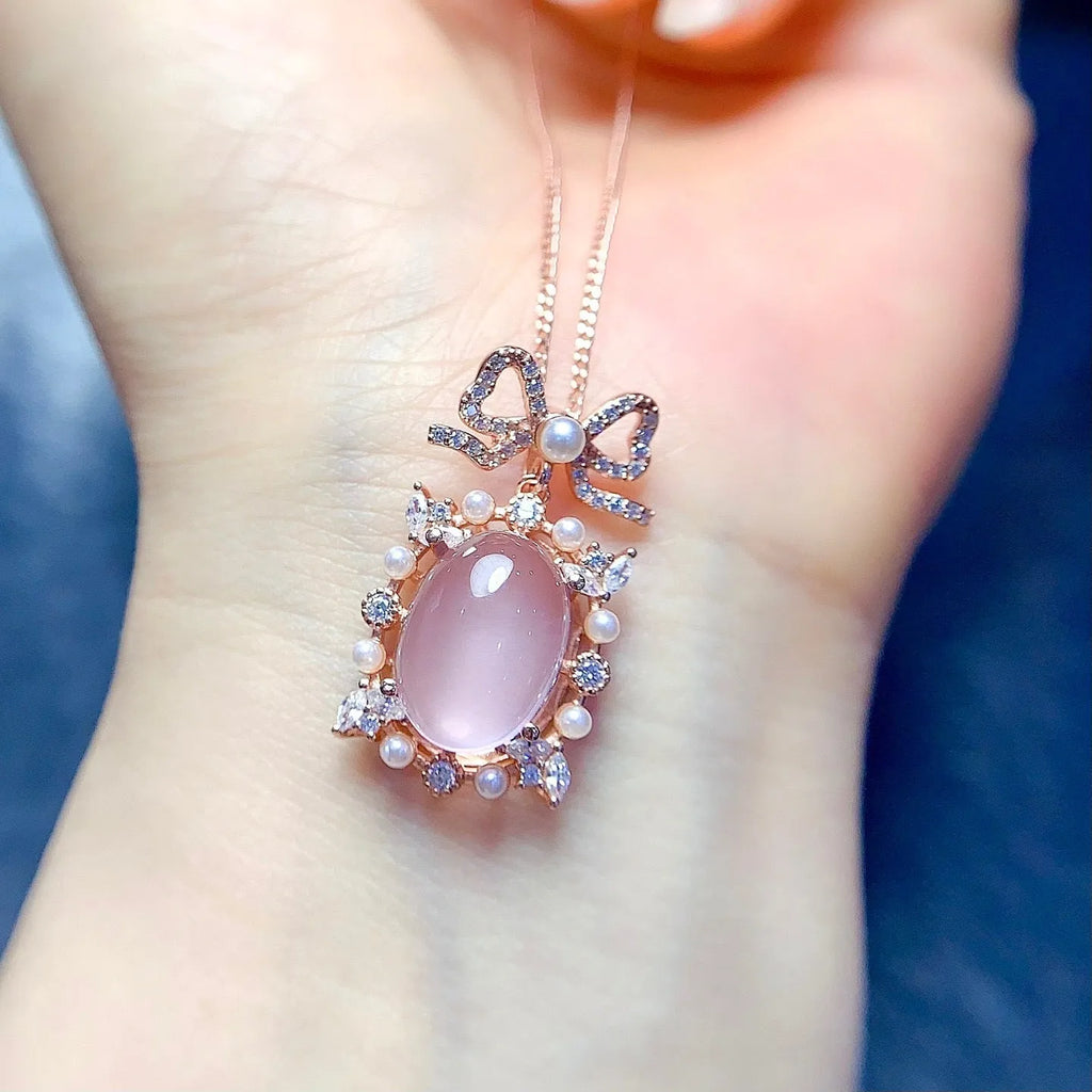 Geometric rose quartz pendant necklace on a silver chain with rose gold plating