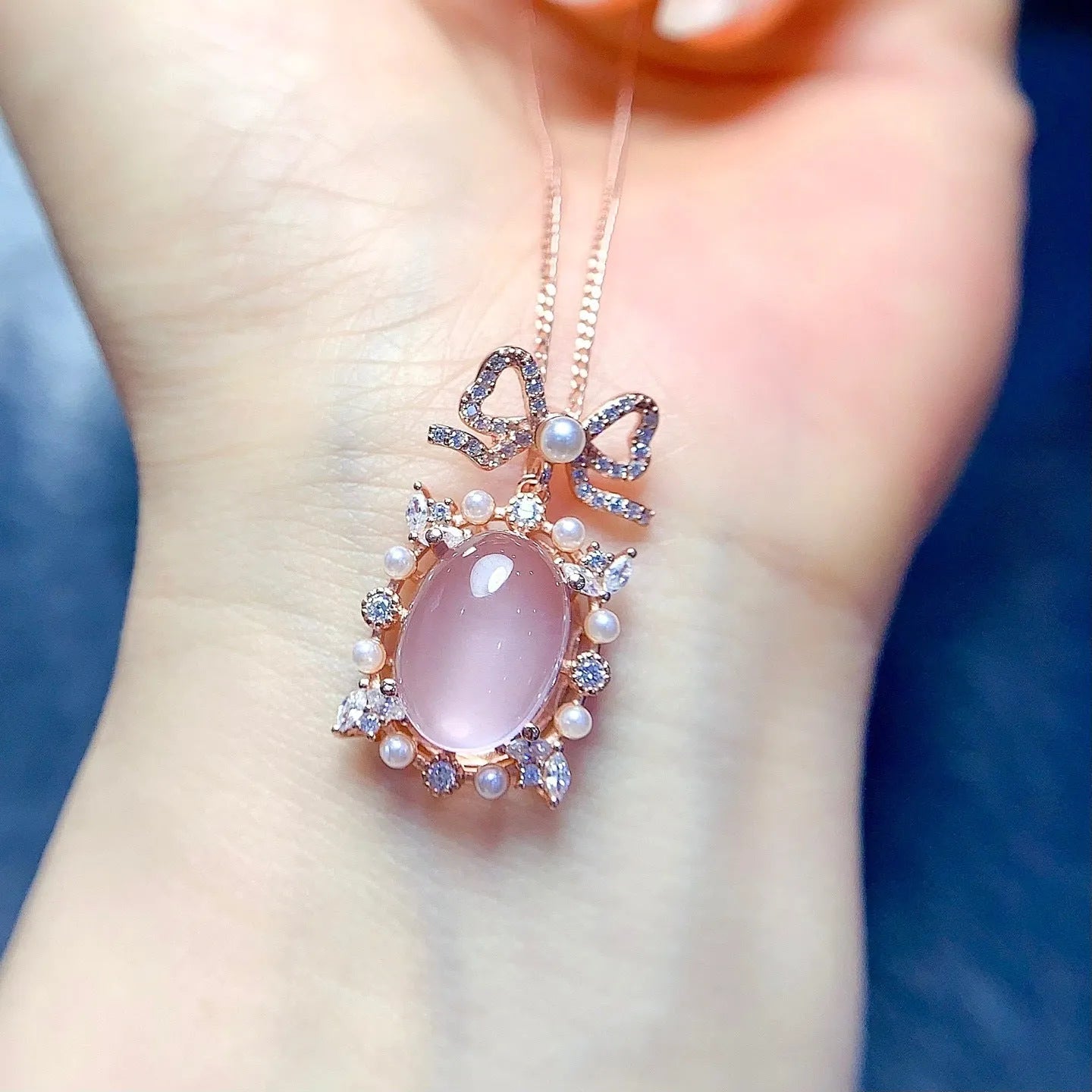 Geometric rose quartz pendant necklace on a silver chain with rose gold plating