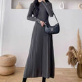 Women's beige knit A-line mid-length skirt with high waist trimming, shown front view.