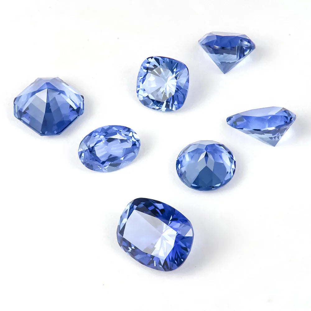 Royal blue love shaped tiara gemstones in various weights and shapes including heart, round, and pear styles