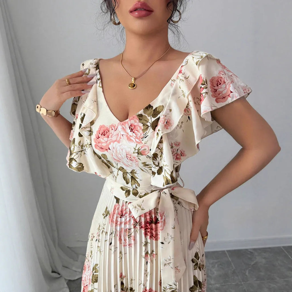 Apricot floral print dress with V-neck, ruffled sleeves, and pleated swing skirt