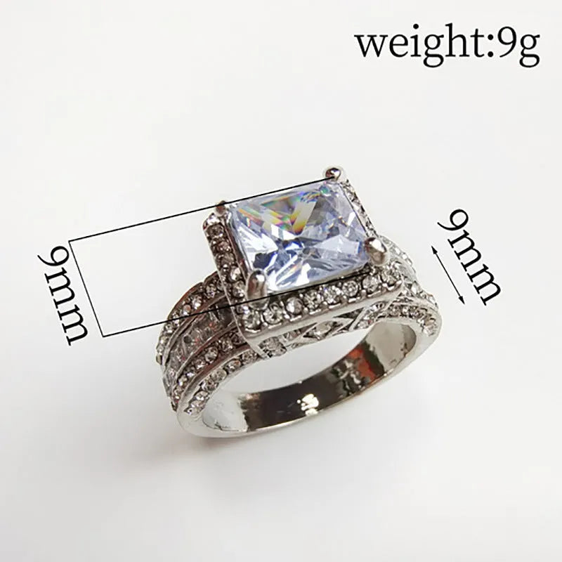 Geometric silver fashion ring for women in gold or white electroplated alloy, showing round design elements.