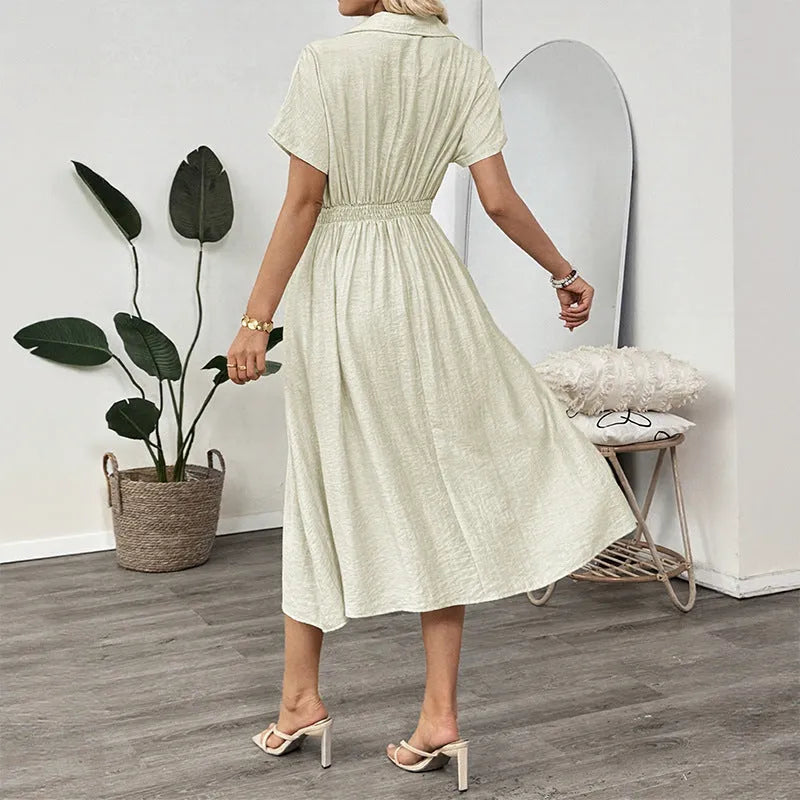 Light green women's shirt dress with lapel collar, waist tie, and skirt pocket on a hanger.