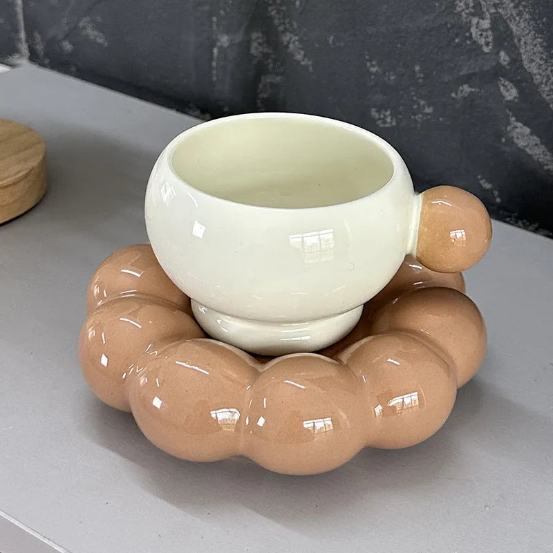 Ceramic coffee cup and dish set in a Nordic style, shown in a choice of solid colours.