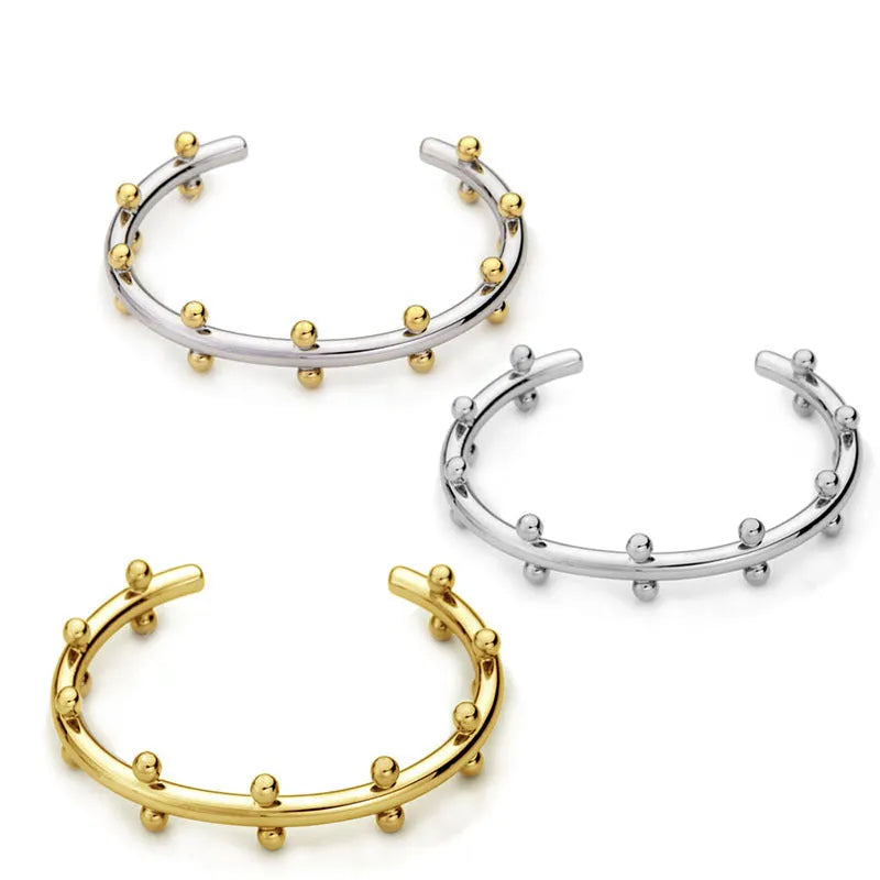 Stainless steel C-shaped rivet bean bead bracelet with alloy chain fastening in gold or steel colour