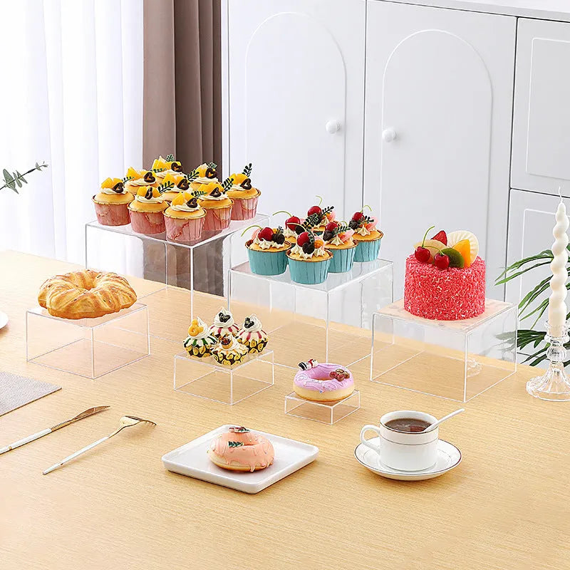 White plastic six-piece suit cube desktop dessert display stand set arranged in tiers.