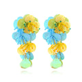 Handmade colourful beaded flower and leaf earrings in exaggerated dopamine style.