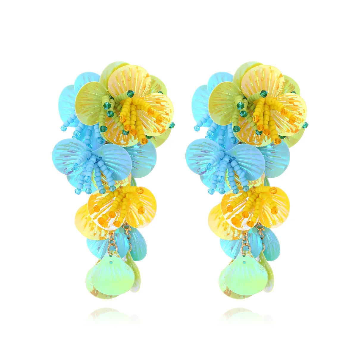 Handmade colourful beaded flower and leaf earrings in exaggerated dopamine style.