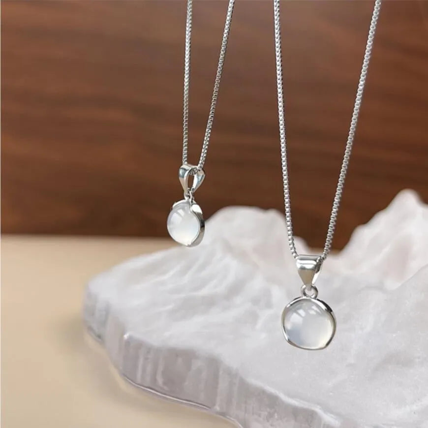 Women's geometric eight-pointed star pendant necklace on an adjustable box chain, moon light colour.