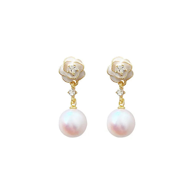Camellia flower shaped stud earrings in alloy metal with floral design details