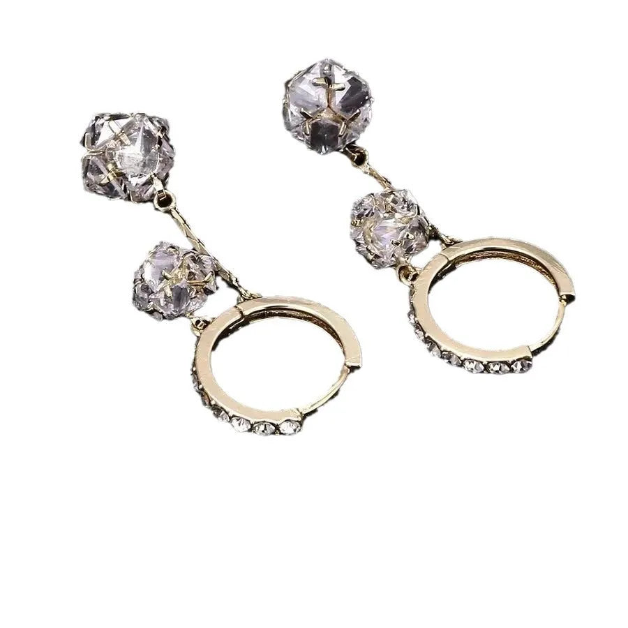 Silver tone clip-on earrings with tassel ball and rhinestone ball pendants in drop design