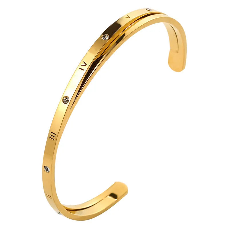 Open-ended stainless steel ladies bracelet with a love symbol and zircon detail, shown in rose gold finish.