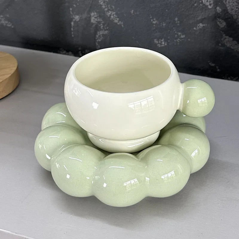 Ceramic coffee cup and dish set in a Nordic style, shown in a choice of solid colours.