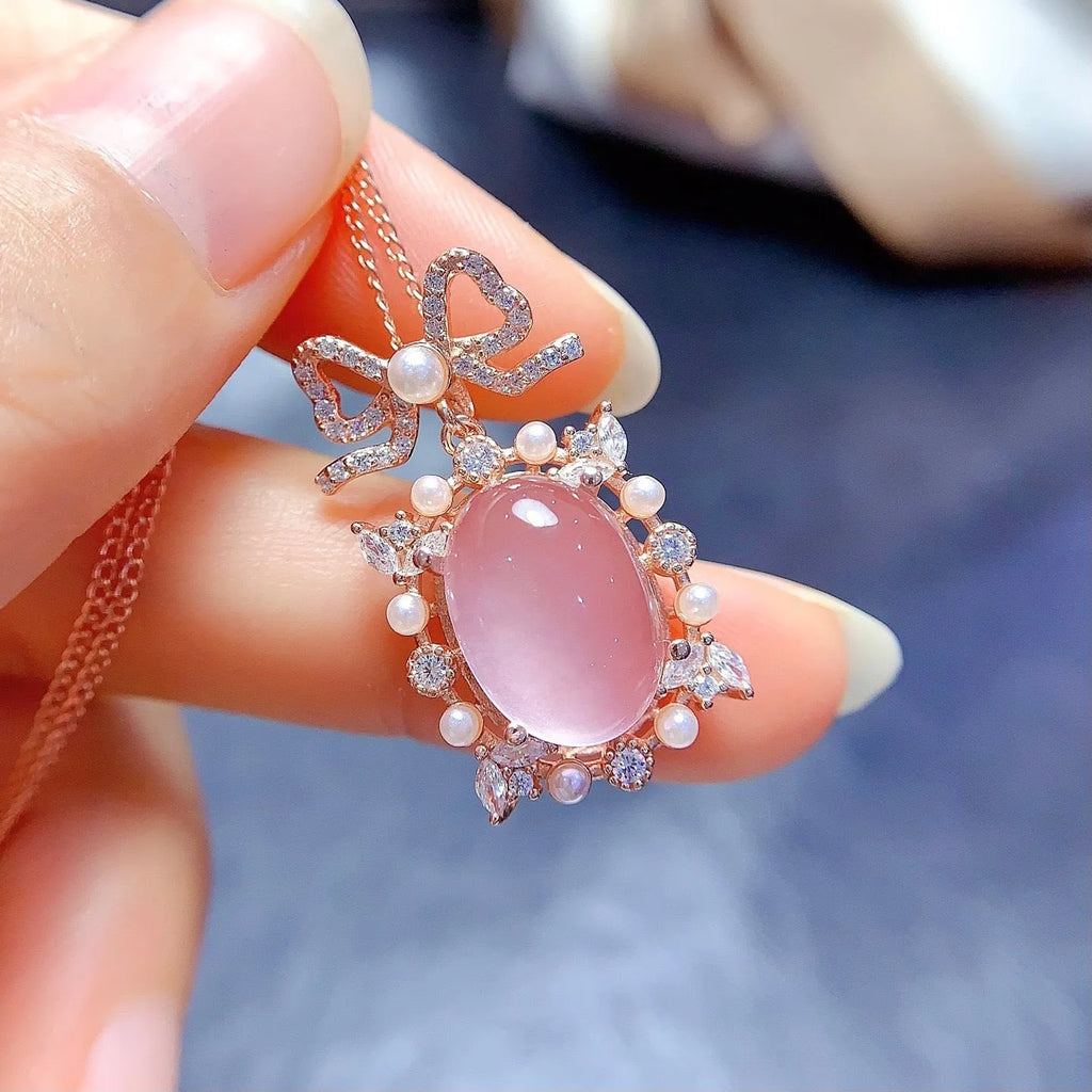 Geometric rose quartz pendant necklace on a silver chain with rose gold plating