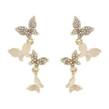 Gold coloured copper earrings with four butterfly design elements for women