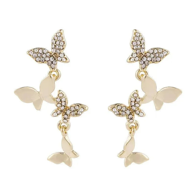 Gold coloured copper earrings with four butterfly design elements for women