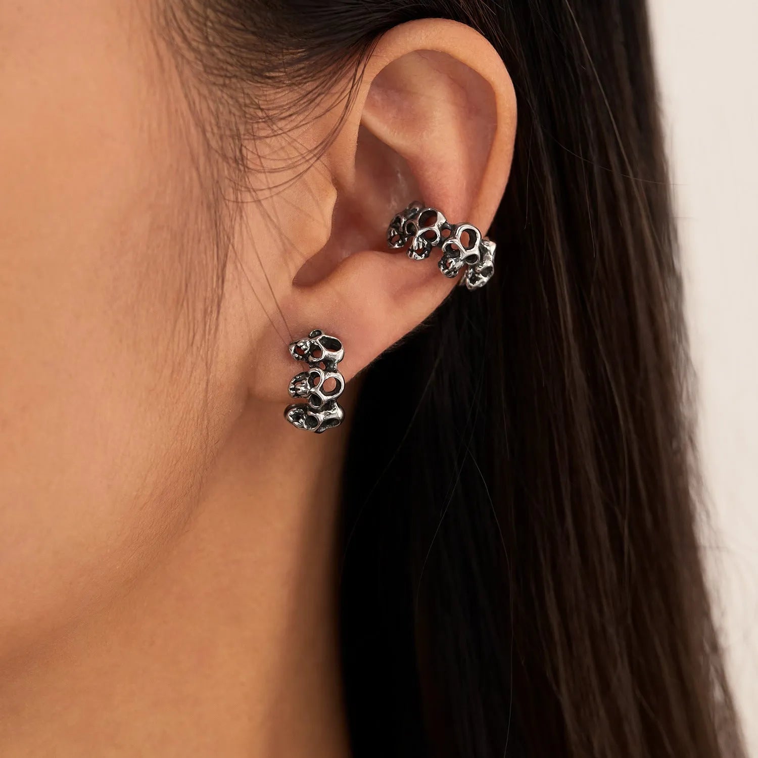 Retro hollow skull design stainless steel clip-on earrings with silver tone finish